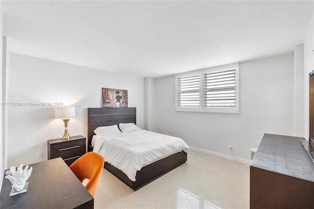 bedroom with light tile patterned flooring