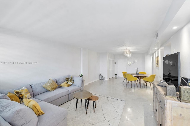 tiled living room with a chandelier