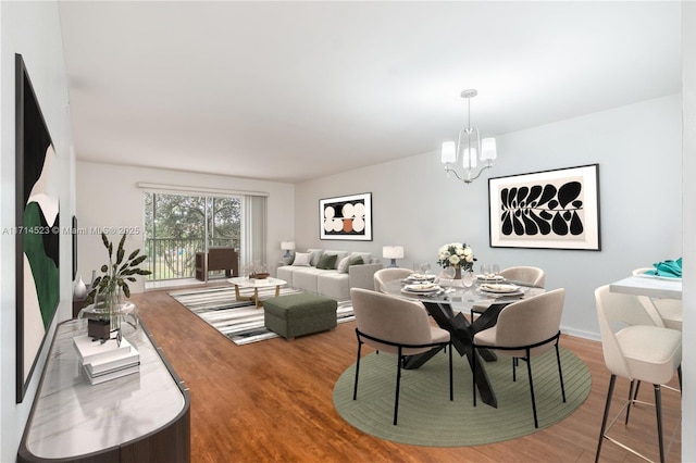 dining area with hardwood / wood-style floors and a chandelier