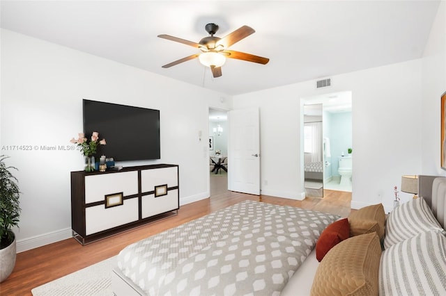 bedroom featuring connected bathroom, hardwood / wood-style flooring, and ceiling fan