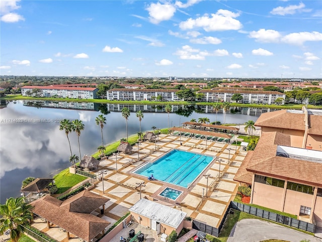 birds eye view of property with a water view