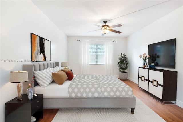 bedroom featuring hardwood / wood-style flooring and ceiling fan