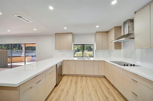 kitchen with kitchen peninsula, stainless steel dishwasher, wall chimney range hood, black electric stovetop, and light brown cabinets