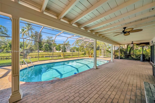 view of pool with a lanai, a patio, and ceiling fan