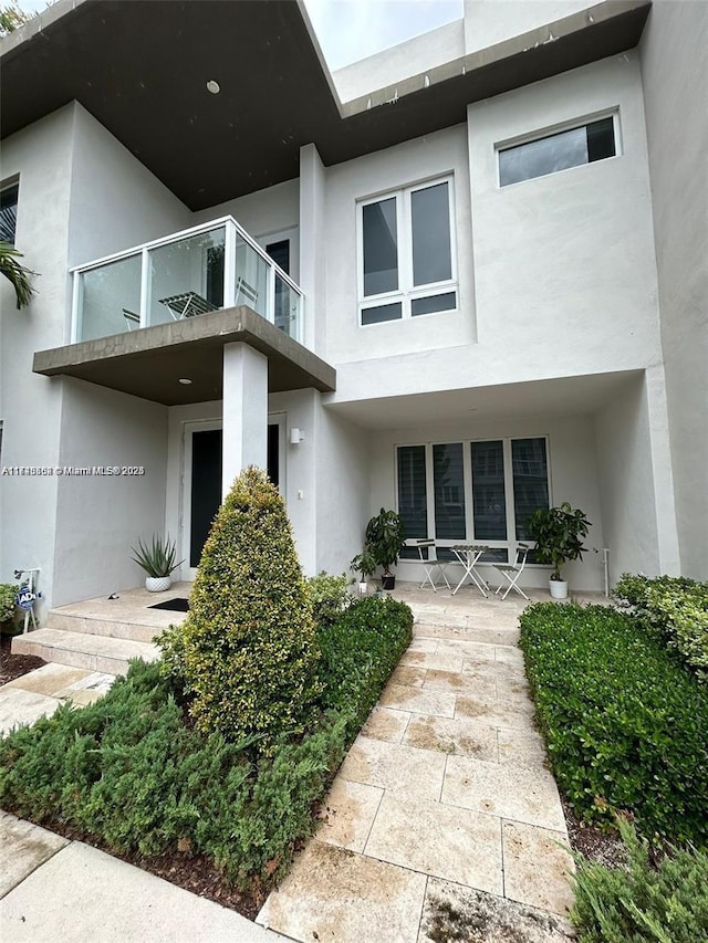 doorway to property with a balcony