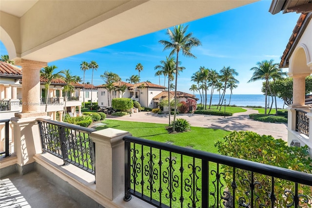 balcony featuring a water view