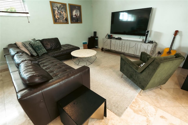 living room with light tile patterned floors