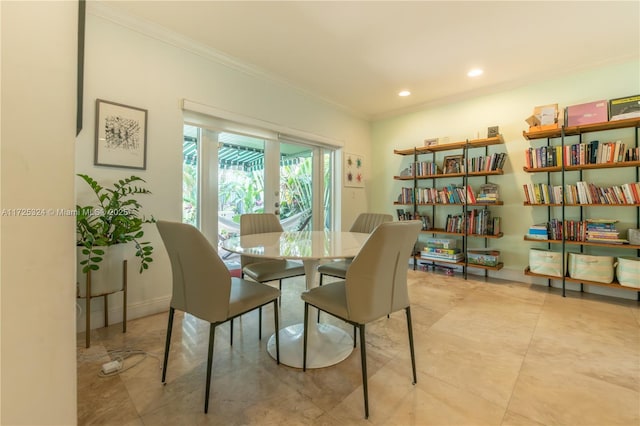 dining space with french doors and ornamental molding