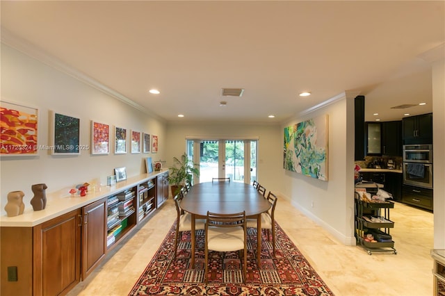 dining area featuring crown molding