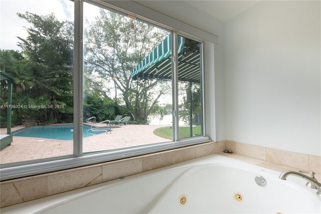 bathroom featuring tiled tub