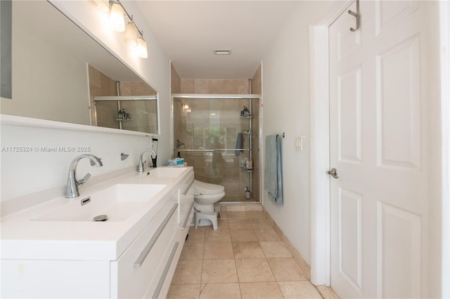 bathroom with toilet, an enclosed shower, tile patterned flooring, and vanity