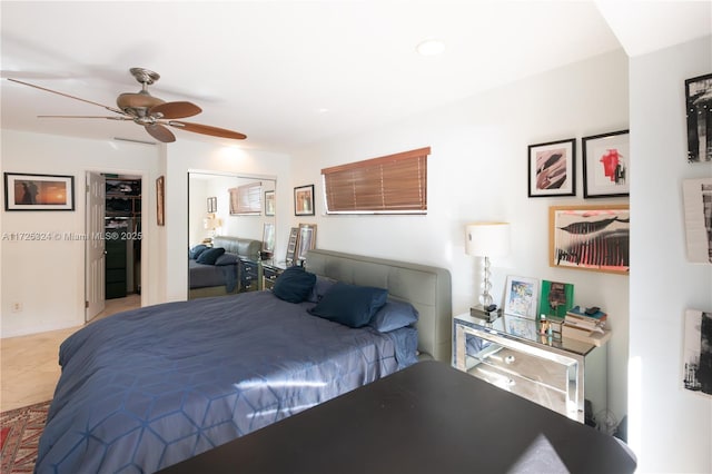 bedroom featuring ceiling fan and a closet