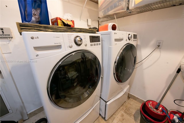 laundry room with separate washer and dryer