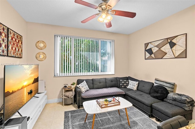 tiled living room featuring ceiling fan