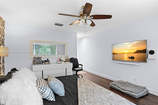 bedroom featuring dark hardwood / wood-style flooring and ceiling fan