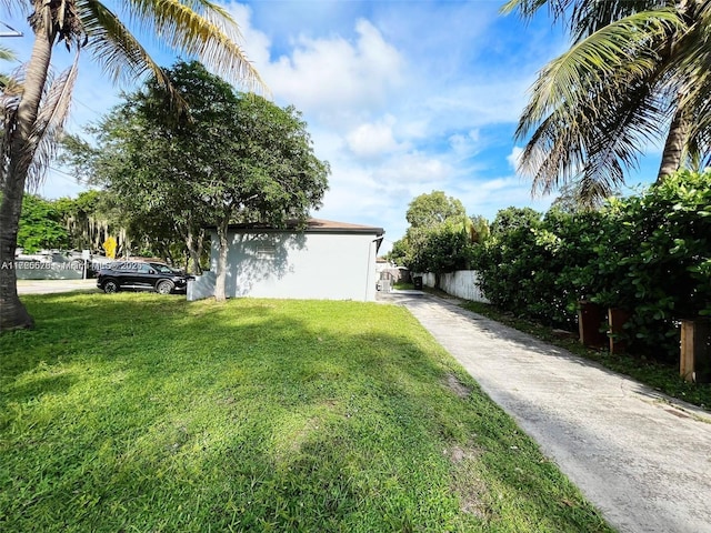 view of property exterior with a lawn