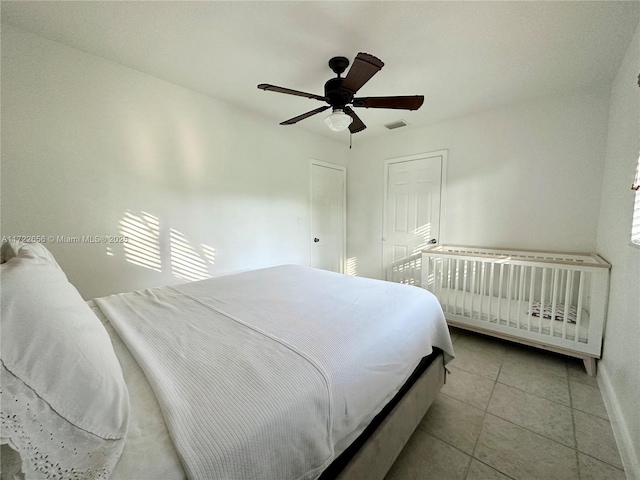 bedroom featuring ceiling fan and light tile patterned floors