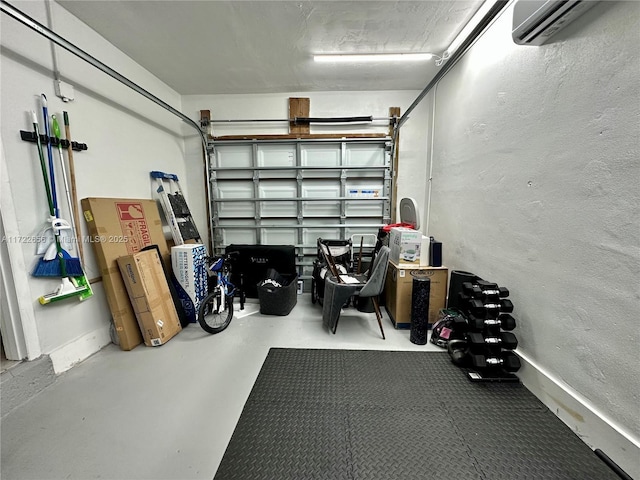 garage featuring a wall mounted AC