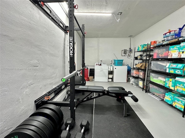 workout room with independent washer and dryer