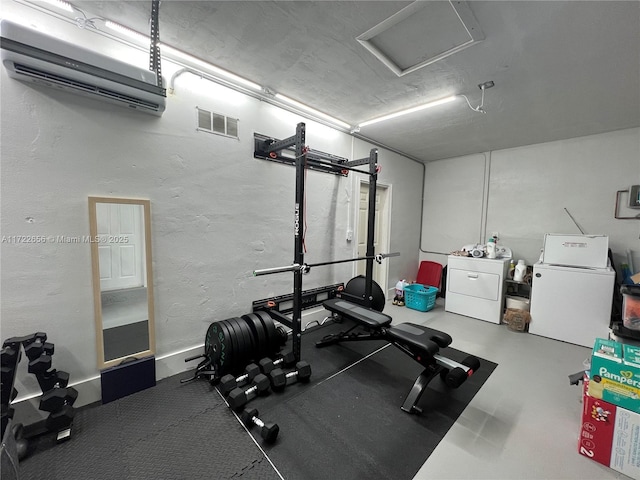 exercise room featuring washing machine and clothes dryer