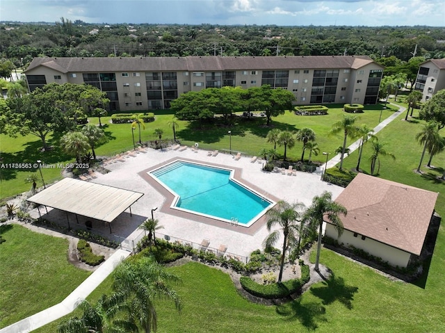 view of swimming pool with a patio area