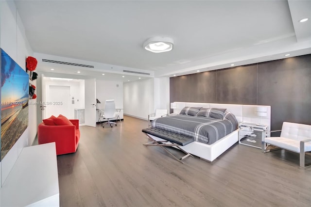 bedroom with hardwood / wood-style floors