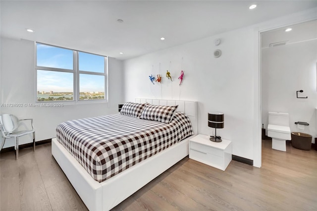 bedroom with light hardwood / wood-style flooring