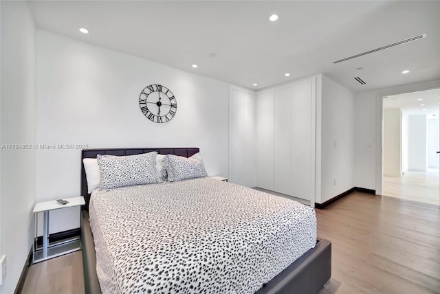 bedroom with light hardwood / wood-style floors