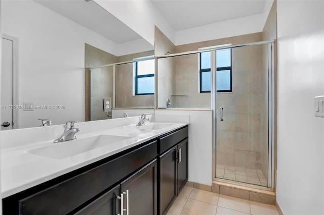 bathroom featuring walk in shower, vanity, and tile patterned floors