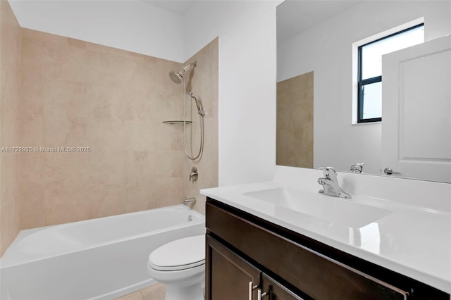 full bathroom with toilet, vanity, tile patterned flooring, and tiled shower / bath