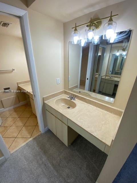 bathroom featuring tile patterned floors and vanity