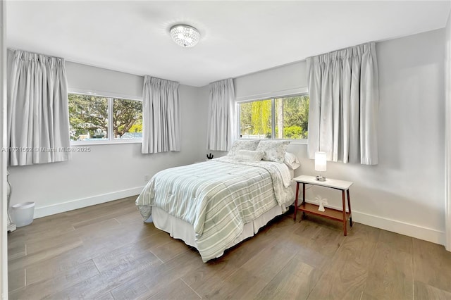 bedroom with hardwood / wood-style floors