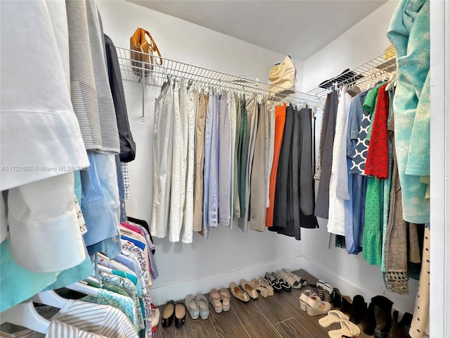 spacious closet featuring hardwood / wood-style floors