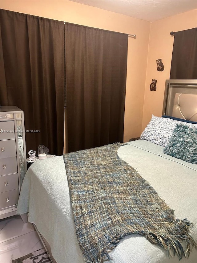 bedroom featuring tile patterned floors