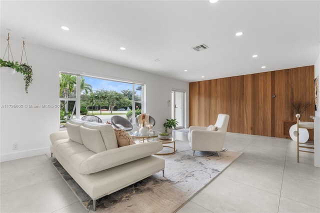 living room featuring wood walls