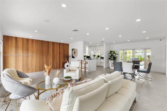 living room featuring wood walls