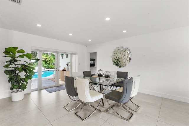 tiled dining area featuring french doors