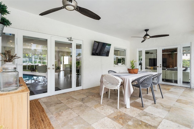 sunroom / solarium with ceiling fan and french doors