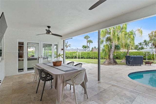 exterior space with ceiling fan