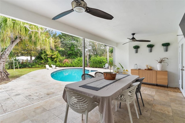 view of swimming pool with a patio area and ceiling fan