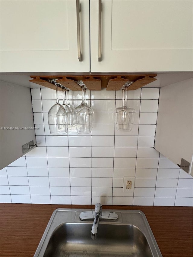 details with sink and decorative backsplash