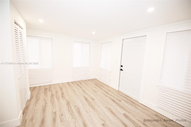 spare room featuring light wood-type flooring