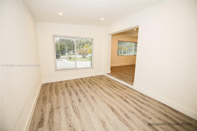 unfurnished room with light hardwood / wood-style floors