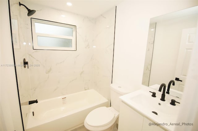 full bathroom featuring toilet, vanity, and tiled shower / bath