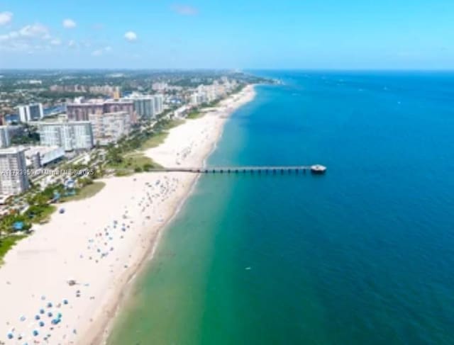 bird's eye view with a beach view and a water view