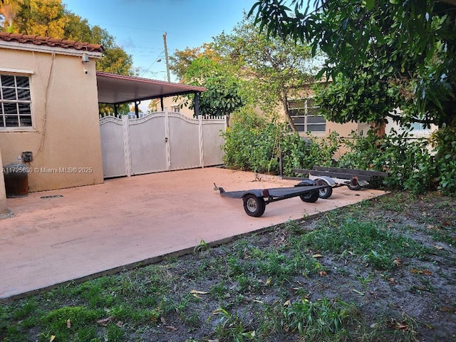 exterior space with fence and a gate