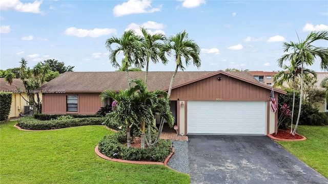 single story home featuring central AC, a front yard, and a garage