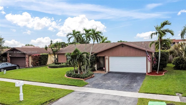 ranch-style home with a front yard and a garage