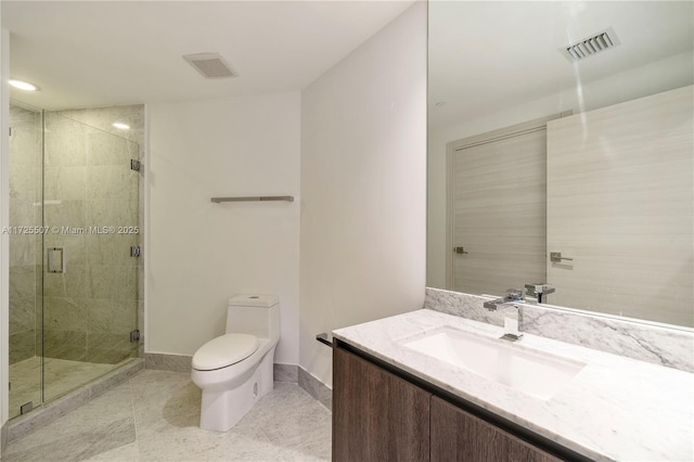 bathroom with toilet, an enclosed shower, vanity, and tile patterned flooring