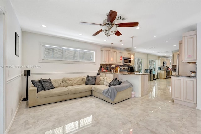 living room featuring ceiling fan